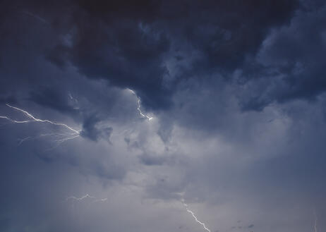 Lightning bolts on a dark background (photograph).